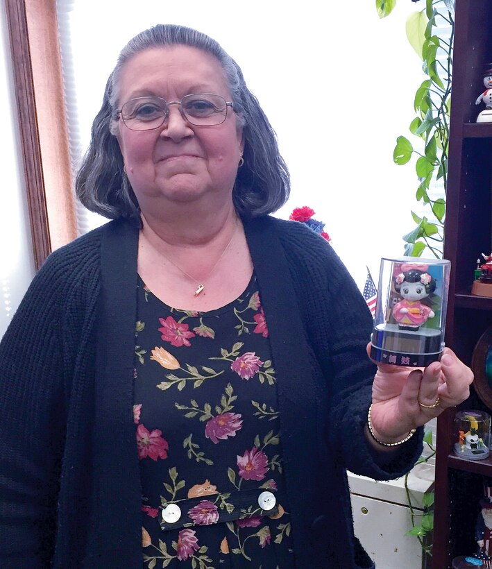 Of the 125 solar panel bobble head Barbara Flores, legal administrative assistant with Quantico's staff judge advocate office, has collected, this is her favorite.