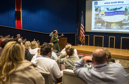 Col. Thomas K. Smith, Jr.,  433rd Airlift Wing commander, gives a wing mission brief to civic leaders from the 403rd Wing, Keesler Air Force Base, Mississippi March 23, 2017 at Joint Base San Antonio-Lackland, Texas.  (U.S. Air Force photo by Benjamin Faske)