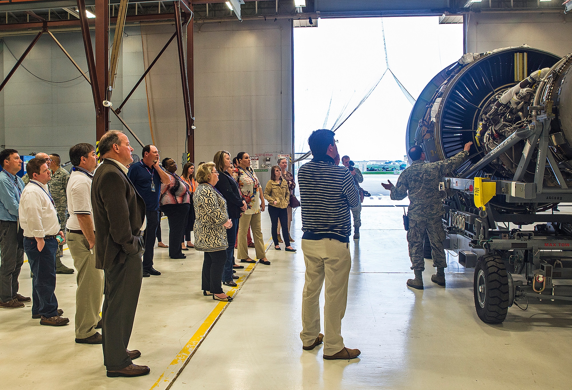 Tech. Sgt. Sean Preston, 433rd Maintenance Squadron aircraft mechanic, explains the benefits of the new C-5M engines to civic leaders from the 403rd Wing, Keesler Air Force Base, Mississippi March 24, 2017 at Joint Base San Antonio-Lackland, Texas. (U.S. Air Force photo by Benjamin Faske)