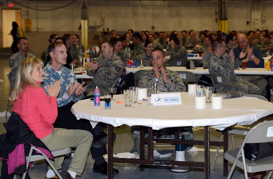 Lt. Col. Mark Szatkowski (center), 62nd Aircraft Maintenance Squadron commander, and McChord civic leaders (left), applaud Knucklebuster nominees March 24, 2017, at Joint Base Lewis-McChord, Wash. An Air Force tradition, Logfest was hosted to recognize Team McChord's best of the best. (U.S. Air Force photo/Senior Airman Jacob Jimenez