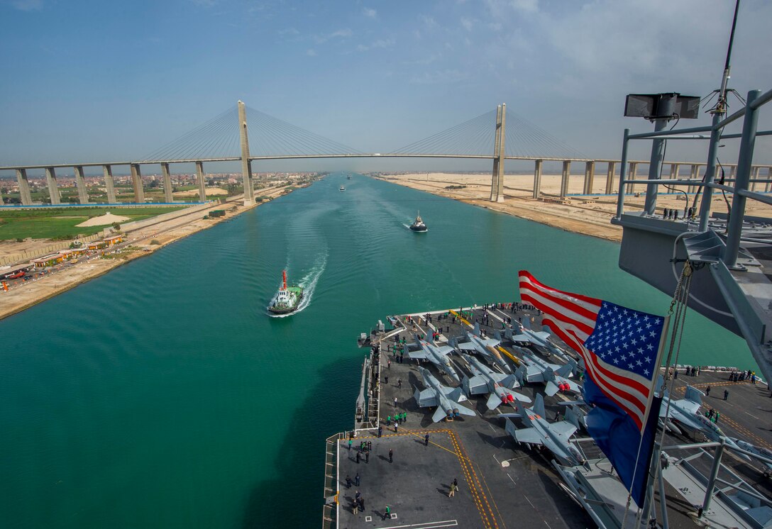 170310-N-OX430-084 
SUEZ CANAL (March 10, 2017) The aircraft carrier USS George H.W. Bush (CVN 77) transits the Suez Canal. The ship and its carrier strike group are deployed in support of maritime security operations and theater security cooperation efforts in the U.S. 5th Fleet area of operations. (U.S. Navy photo by Mass Communication Specialist 3rd Class Daniel Gaither/Released)