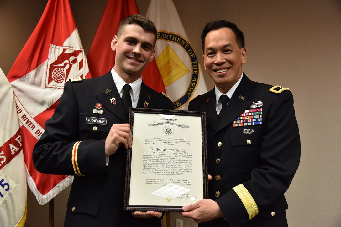 CPT Doug Kramer with Brig. Gen. Toy at his promotion ceremony.