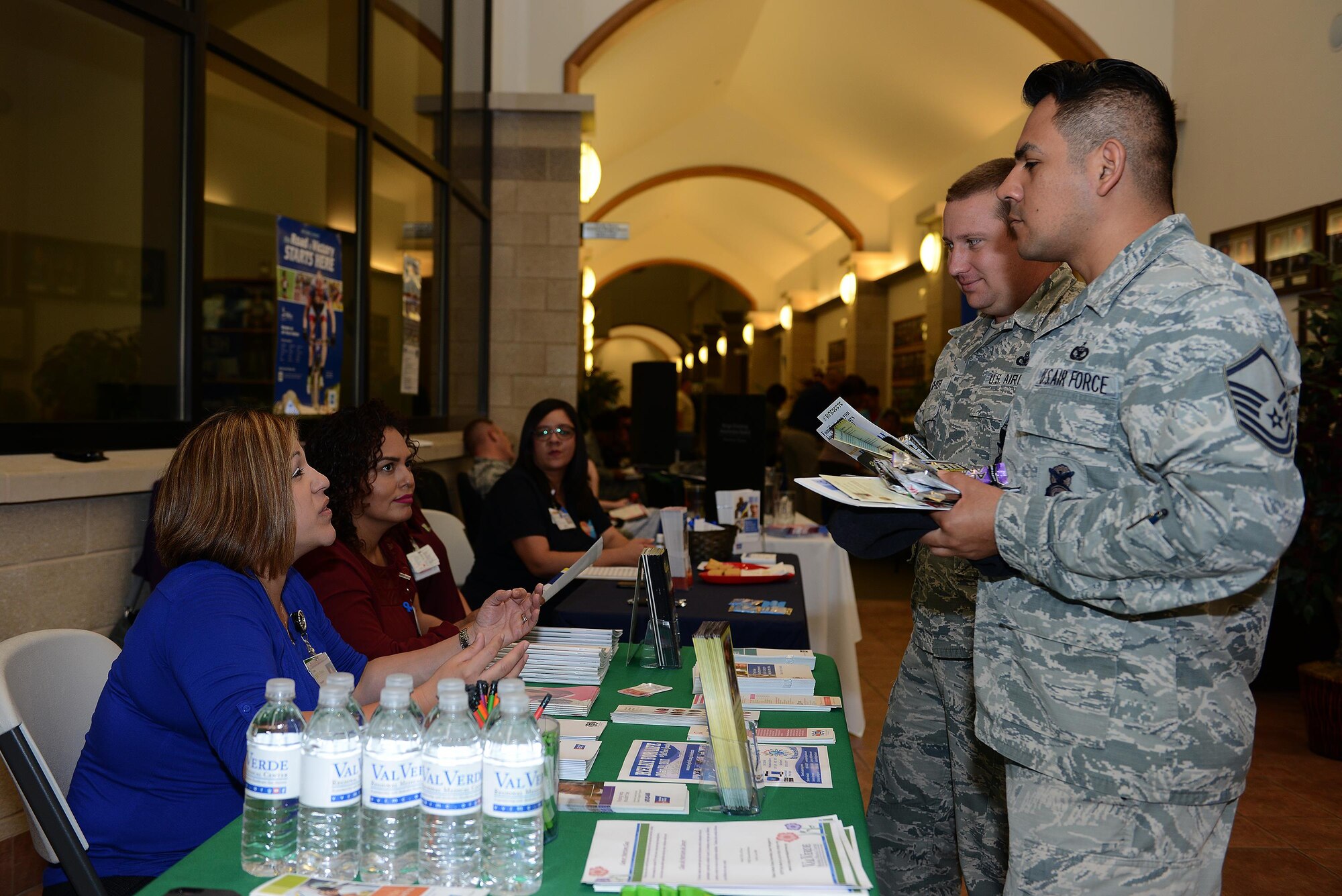 Master Sgt. Jose Cruzbarbosa, 47th Security Forces Squadron section chief, speaks with a local representative during a health expo on Laughlin Air Force Base, Texas, March 22, 2017. The health expo brought together various on-base and off-base agencies that promote fitness, heal and wellness. (U.S. Air Force photo/ Airman 1st Class Benjamin N. Valmoja)