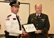 ESGR Volunteer Retired First Lieutenant Phil Albert (right) presents the Patriot Award to Major Mark Knott of the West Warwick Police Department