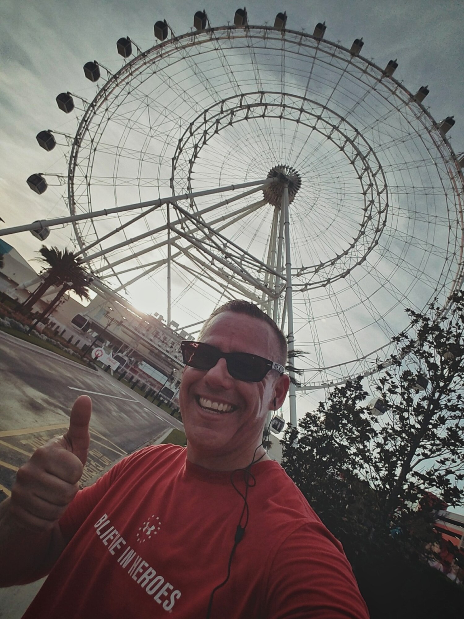 Christopher Parr, 932nd Airlift Wing Public Affairs specialist, grabs a quick "selfie" with the Orlando Eye in the background, while in Florida for the Air Force Association's Air Warfare Symposium.  Despite traveling to vacation destinations, Parr said he needed to get in his runs for the Scott Health Promotion Running Clinic. You can follow along as Parr documents his journey to becoming a better runner in the commentaries section of the 932nd AW website. http://www.932aw.afrc.af.mil/News/Commentaries.aspx (U.S. Air Force photo by Christopher Parr)