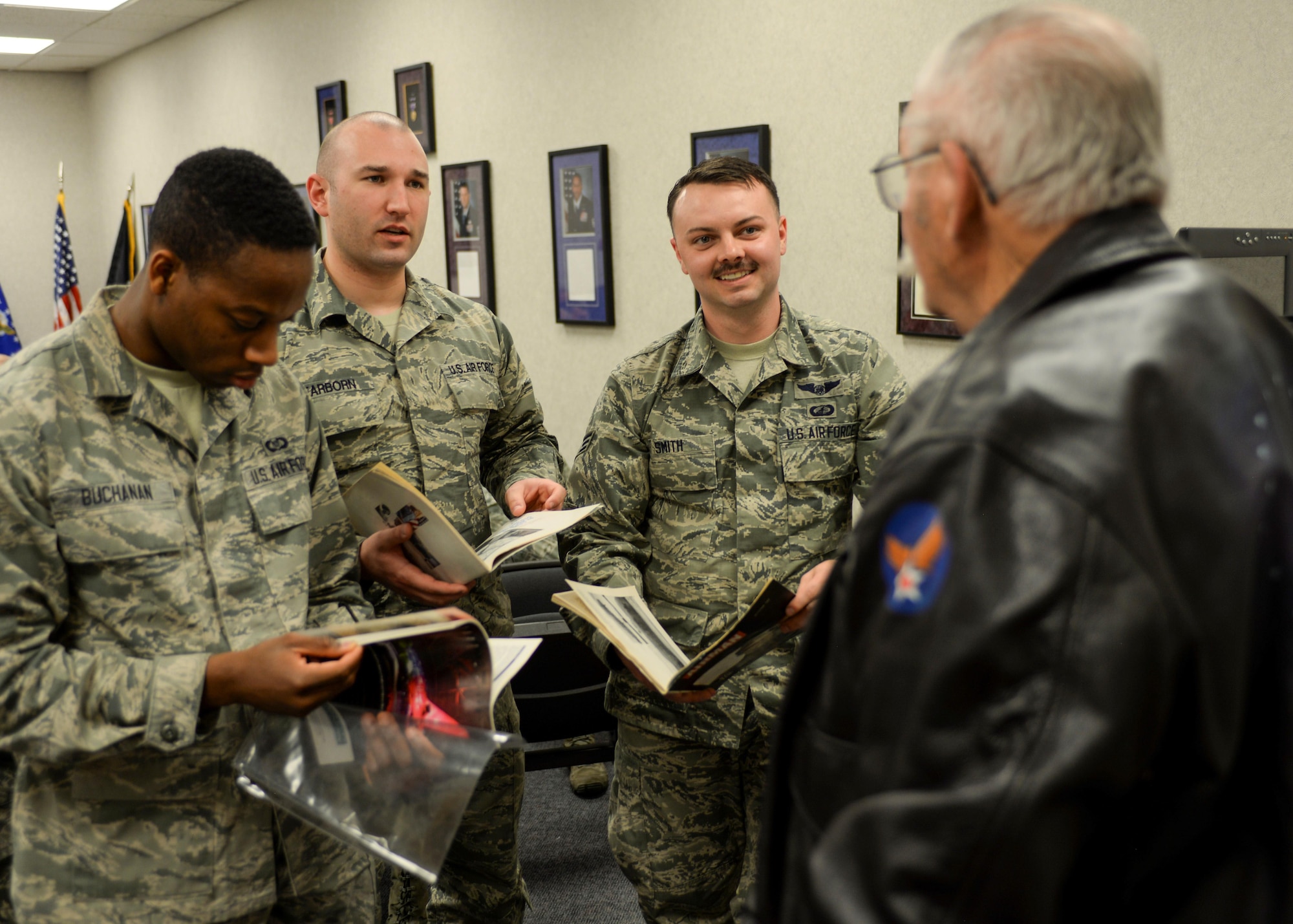 Airmen ask questions of Robert Schilling, a former Airman and gunner on the AC-47 “Spooky,” inside the Airman Leadership School at Ellsworth Air Force Base, S.D., March 20, 2017. Schilling was an Airman during the Vietnam War, and now tells his stories to help enlighten the next generation of Air Force leaders. (U.S. Air Force photo by Airman 1st Class Randahl J. Jenson)   