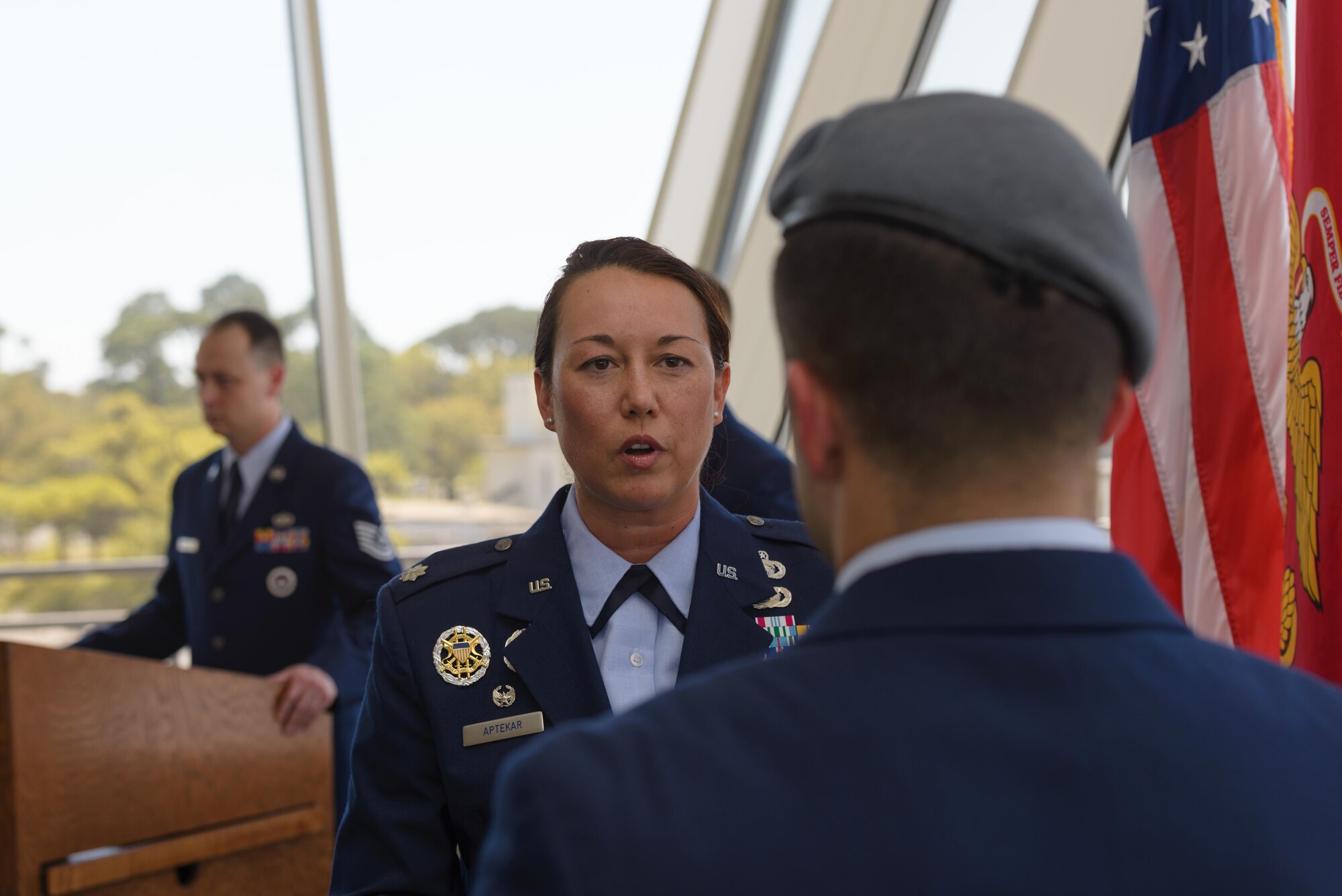 Lt. Col. Elizabeth Aptekar, 335th Training Squadron commander, congratulates Senior Airman Matthew James, 335th TRS student, after graduating from the Special Operations Weather Apprentice Course at the Weather Training Complex, March 22, 2017, on Keesler Air Force Base, Miss. At his graduation James received his Gray Beret. (U.S. Air Force photo by Andre’ Askew) 