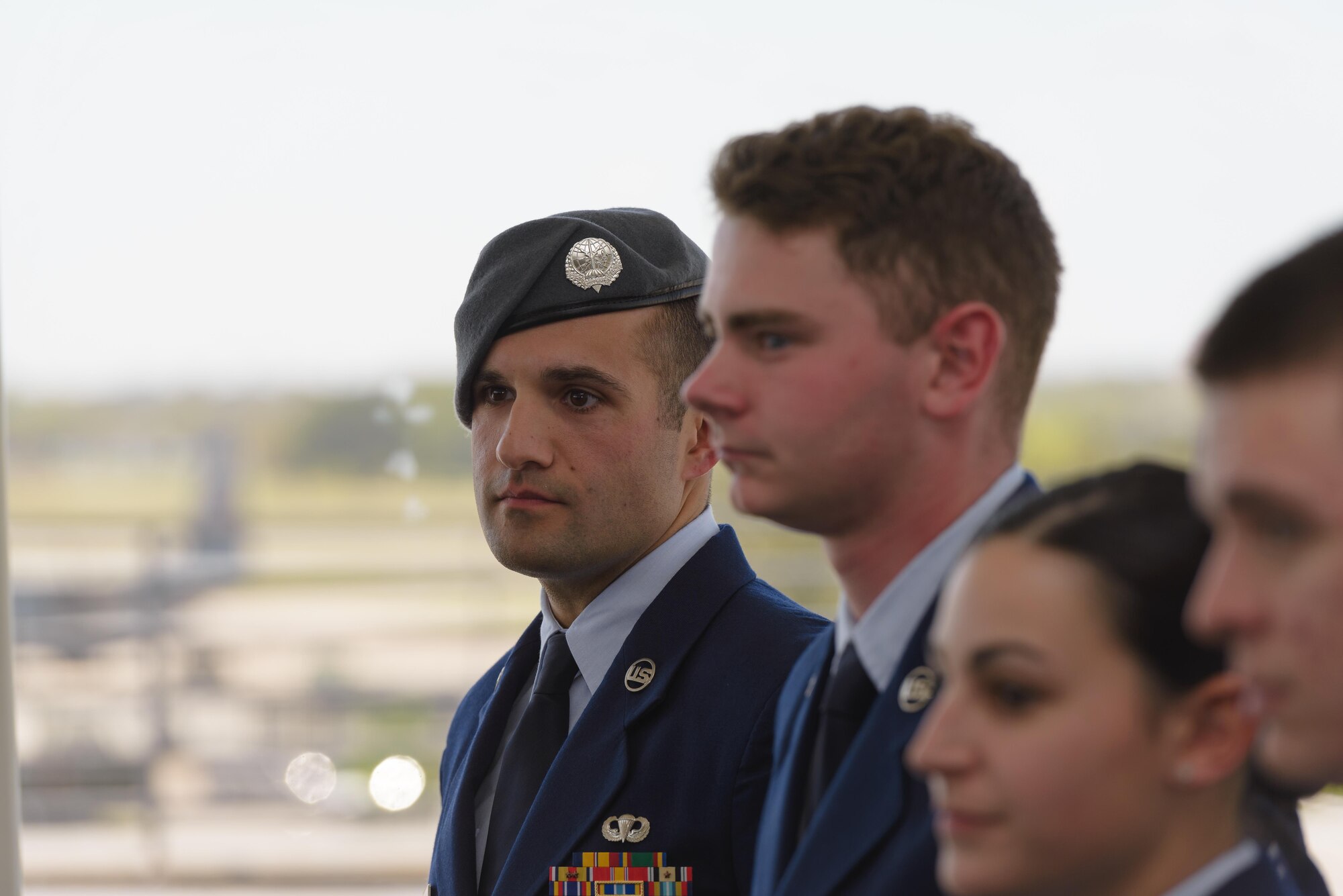 Senior Airman Matthew James, 335th Training Squadron student, listens to the guest speaker during a Special Operations Weather Apprentice Course graduation ceremony at the Weather Training Complex, March 22, 2017, on Keesler Air Force Base, Miss. At his graduation James received his Gray Beret. (U.S. Air Force photo by Andre’ Askew) 