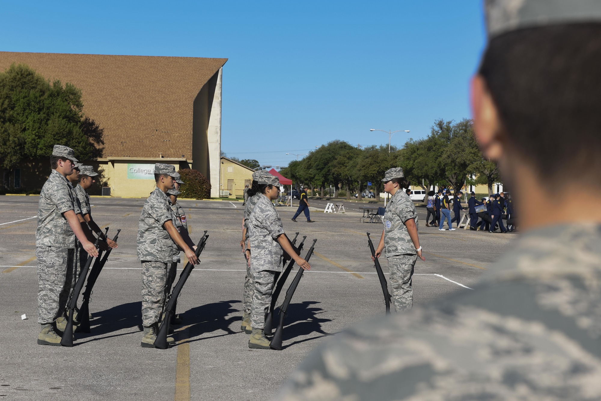 A Texas state High School JROTC flight prepares to demonstrate a drill at the 19th Annual Drill Competition at Angelo State University in San Angelo, Texas, March 25, 2017. The drill featured rifles and complicated movements. (U.S. Air Force photo by Airman 1st Class Chase Sousa/Released)