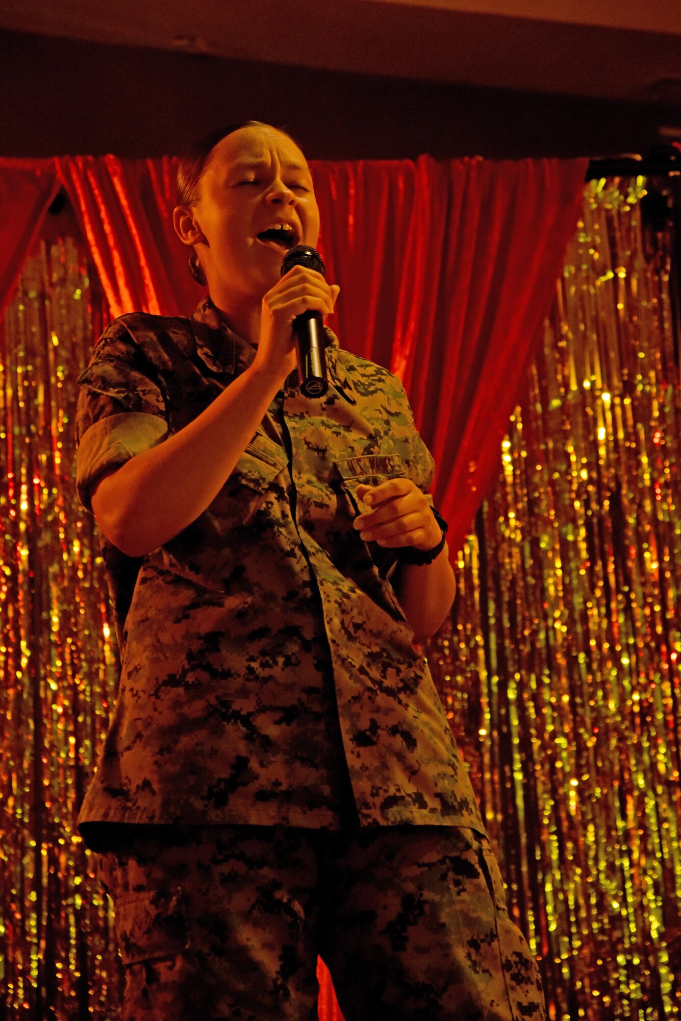 U.S. Marine Corps Lance Cpl. Morgan Piatt, Marine Corps Detachment student, sings during “Goodfellow’s Got Talent” at the event center on Goodfellow Air Force Base, Texas, March 24, 2017. She placed first in the show. (U.S. Air Force photo by Staff Sgt. Joshua Edwards/Released)