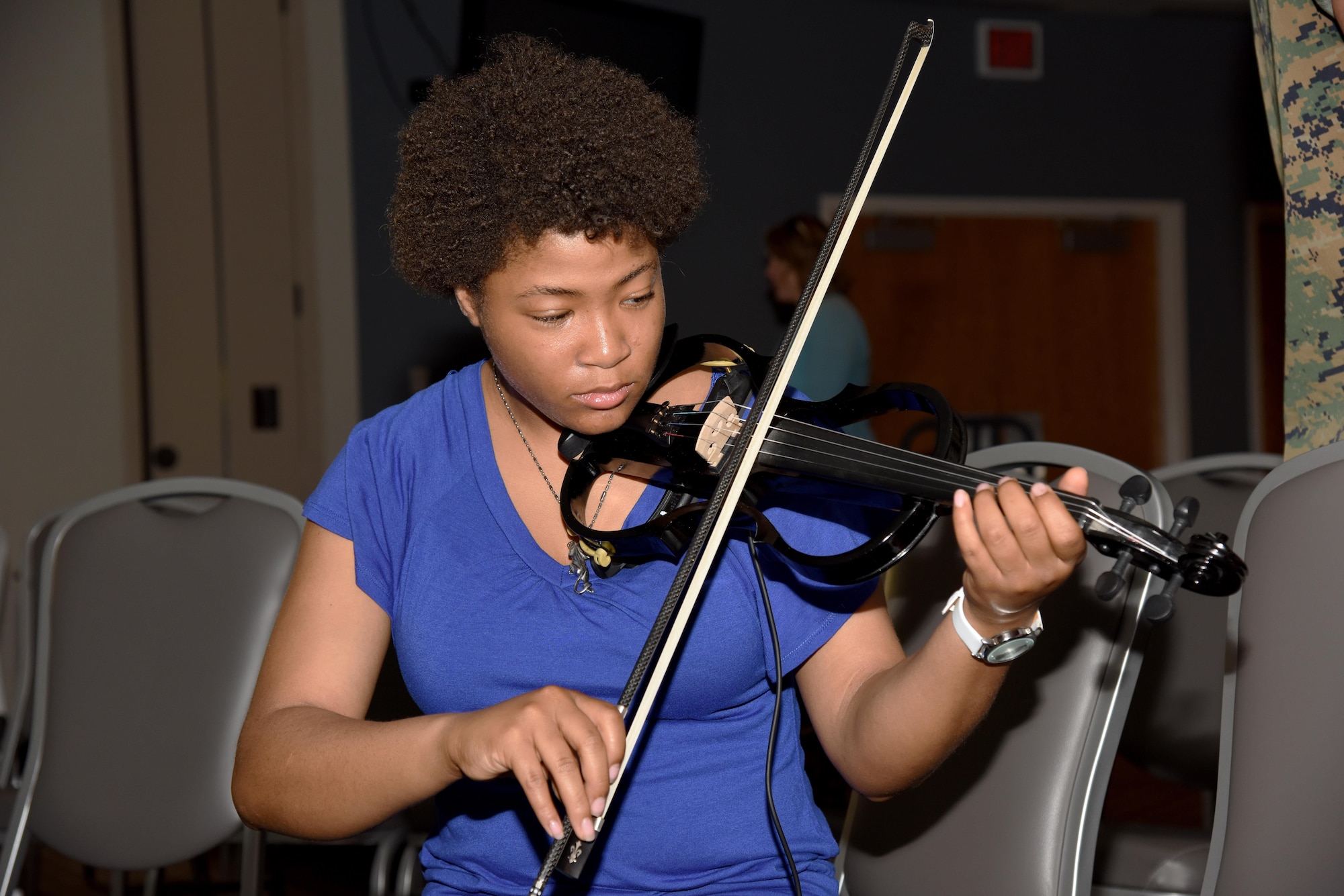 U.S. Air Force Airman 1st Class Lenay Tyler, 315th Training Squadron student, plays an electric violin during a warm-up session before Goodfellow’s Got Talent at the event center on Goodfellow Air Force Base, Texas, March 24, 2017. The talent show featured 10 acts that included poetry, singing and dancing. (U.S. Air Force photo by Staff Sgt. Joshua Edwards/Released)