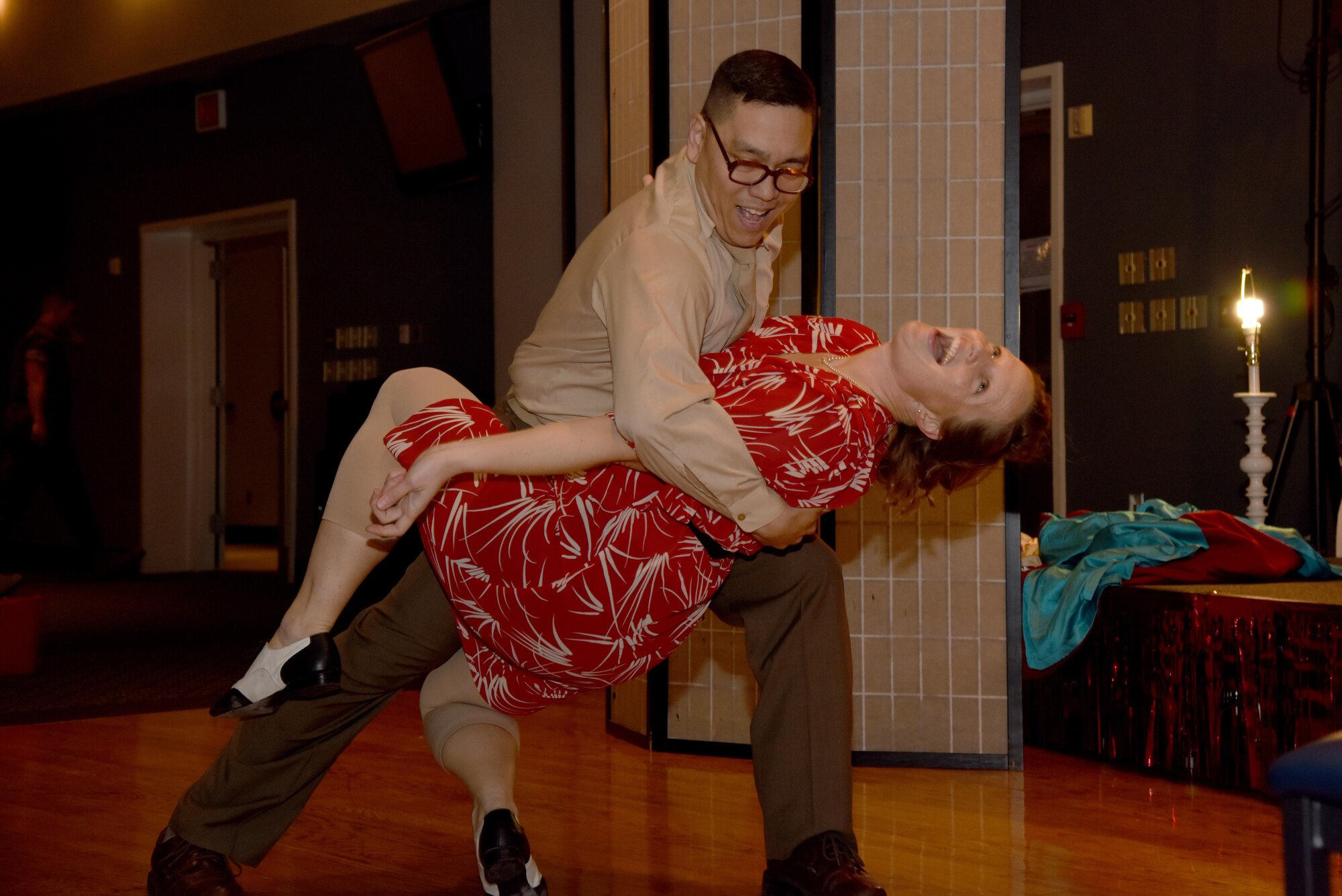 U.S. Army Lt. Col. Yukio Kuniyuki, 344th Military Intelligence Battalion Commander, and Karyn Kuniyuki dance during “Goodfellow’s Got Talent” at the event center on Goodfellow Air Force Base, Texas, March 24, 2017. The Kuniyukis went on to win second place. (U.S. Air Force photo by Staff Sgt. Joshua Edwards/Released)