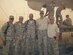Tech. Sgt. Terrance Williams, center, currently 22nd Security Forces Squadron resources NCO in-charge, poses for a photo July 2011, in Balad, Iraq. Williams deployed nine times during his career, six of which were to combat locations. (Courtesy photo)