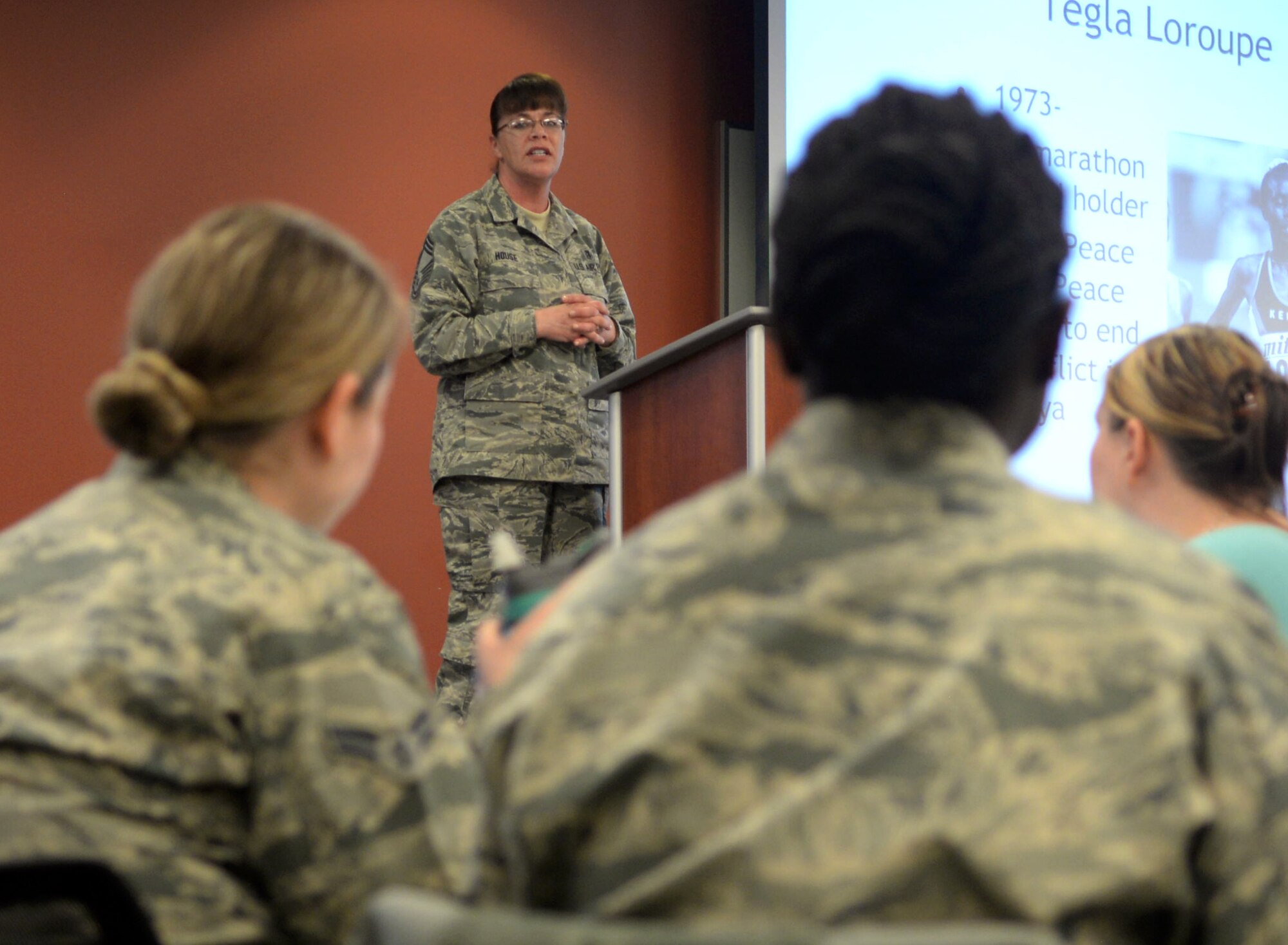 Chief Master Sgt. Tracey House, the 28th Medical Group superintendent, speaks during a Women’s History Month luncheon inside the Deployment Center at Ellsworth Air Force Base, S.D., March 21, 2017. House, along with two other guest speakers, spoke on her experiences in the military and how women in her life have helped shape her career. (U.S. Air Force photo by Airman 1st Class Denise M. Jenson)