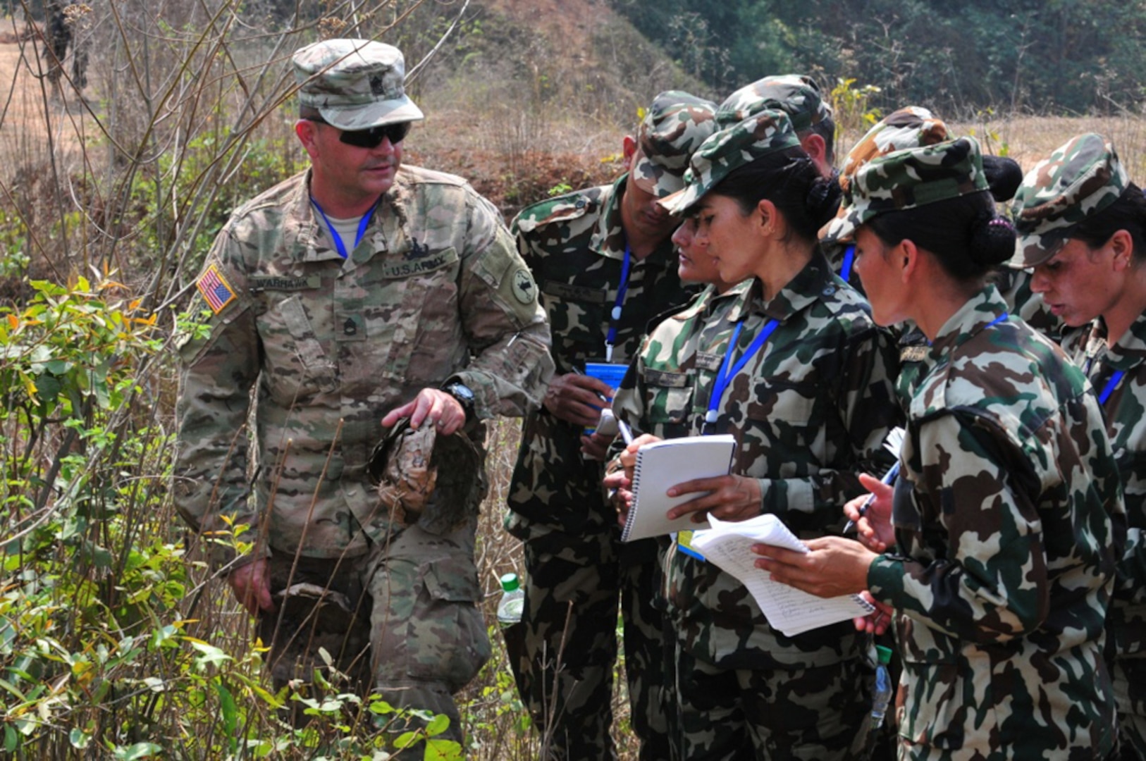 Sgt. 1st Class Christopher Warhawk helps soldiers from the Nepalese Army identify an improvised explosive device during Multinational Peacekeeping Exercise Shanti Prayas III March 24, 2017 at the Birendra Peace Operations Center in Panchkhal, Nepal. Shanti Prayas is a multinational United Nations peacekeeping exercise designed to provide pre-deployment training to U.N. partner countries in preparation for real-world peacekeeping operations. 