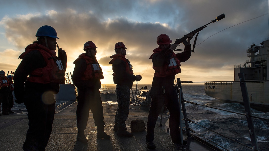 Navy Petty Officer 2nd Class James Maddox fires a shot line to the Military Sealift Command fleet oiler USNS Carl Brashear as the USS Pinckney begins a replenishment in the Pacific Ocean, March 26, 2017. The ship is participating in a composite training unit exercise, testing the mission readiness of the strike group’s assets through simulated real-world scenarios. Navy photo by Petty Officer 3rd Class Craig Z. Rodarte