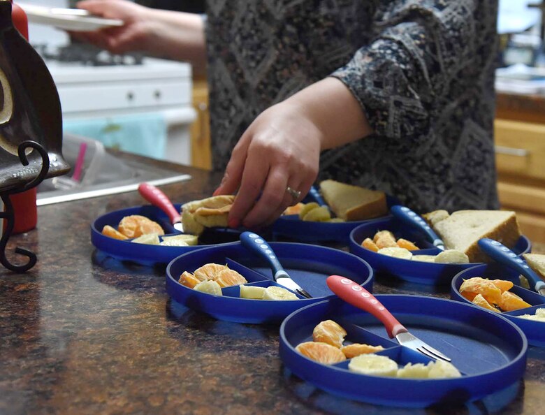 Liz Arrexi, 341st Force Support Squadron family child care home provider, makes lunch March 24, 2017, at Malmstrom Air Force Base, Mont. Arrexi is an FCC child care provider and uses healthy foods for the children in her in-home day care. (U.S. Air Force photo/Senior Airman Jaeda Tookes)