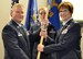 During an assumption-of-command ceremony, Col. Karen Steiner (right) accepts the 302nd Aeromedical Staging Squadron guidon from Col. James DeVere, the 302nd Airlift Wing commander,    while the squadron’s first sergeant, Master Sgt. Cortney Shank, looks on at Peterson Air Force Base, Colorado, March 5, 2017.,. (U.S. Air Force photo/1st Lt. Stephen J. Collier)