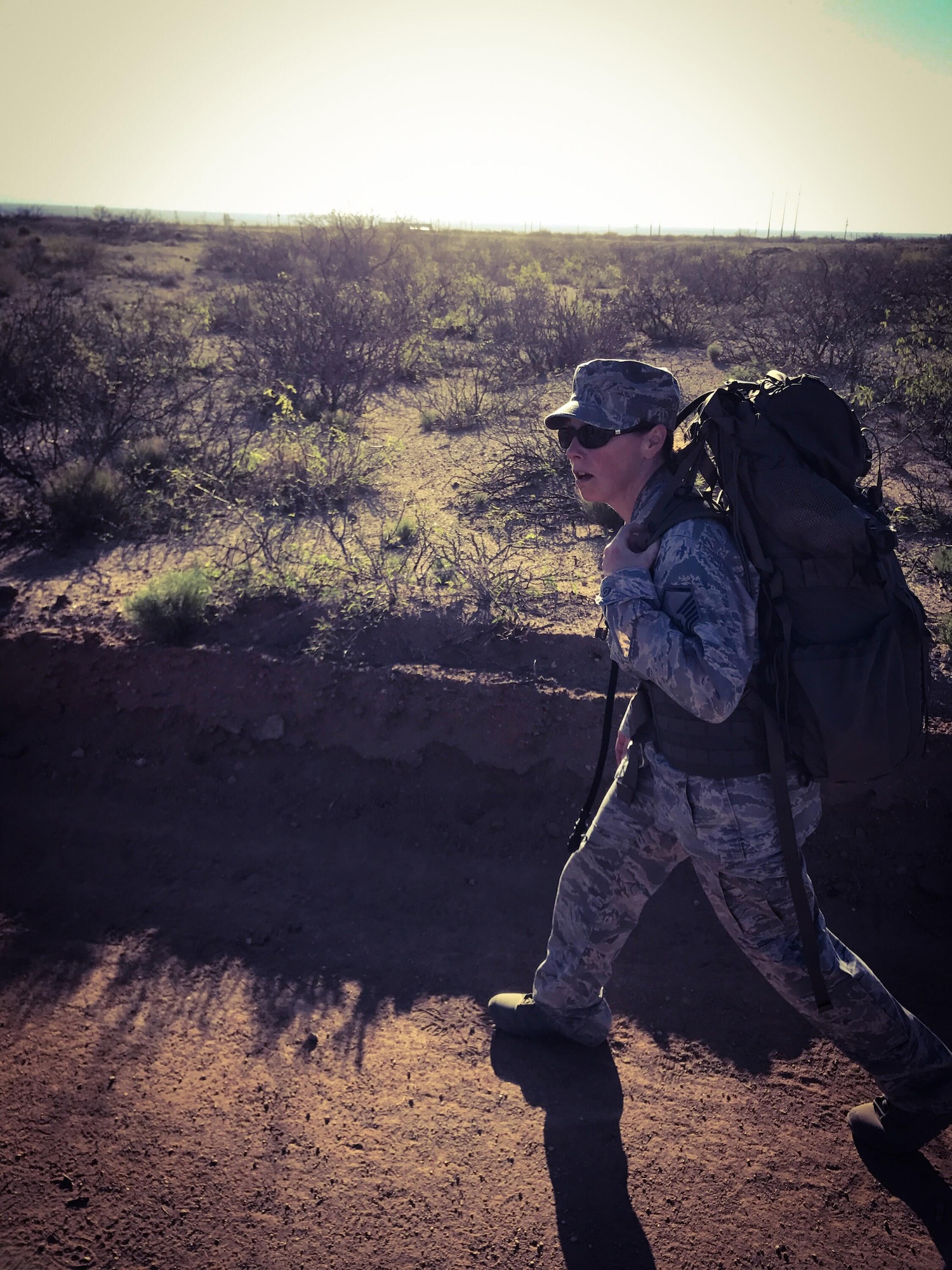 WHITE SANDS MISSILE RANGE, N.M. - Master Sgt. Katherine Hammer, 302nd Airlift Wing law office superintendent, participates in the 75th Bataan Memorial Death March at White Sands Missile Range, N.M., March 19, 2017. Hammer partook in the military individual division where participants have to march the 26.2 miles in their respective uniforms, wear rucksack with at least 35 pounds and contribute their unit coin. (Courtesy photo by Ben Peterson)
