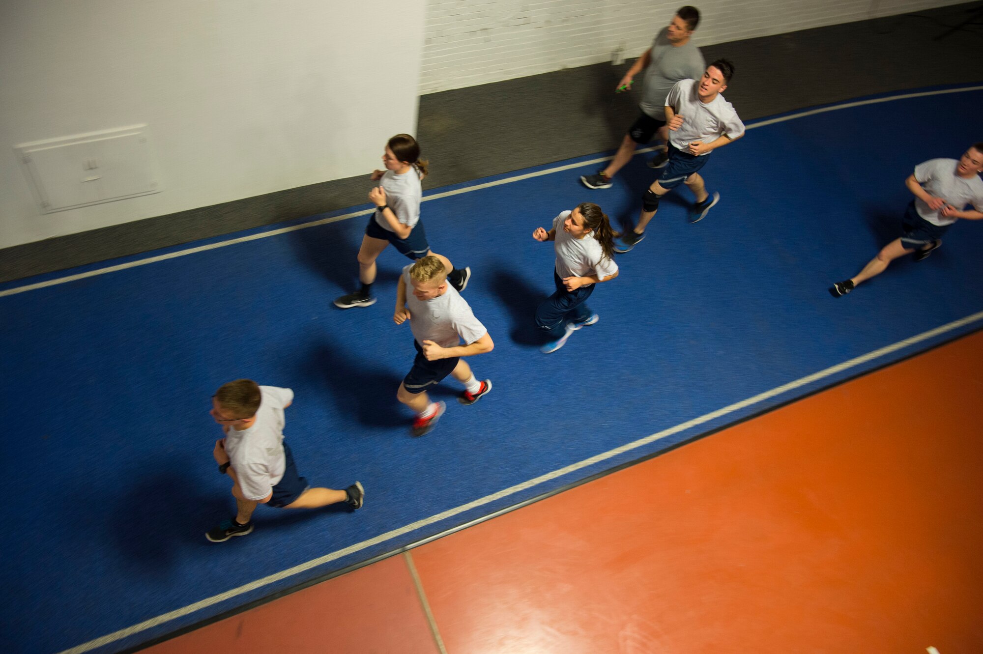 Members of the 790th Missile Security Forces Squadron run on the indoor track during squadron physical training on F.E. Warren Air Force Base, Wyo., Feb. 1, 2017. During the winter months, many squadrons utilize the indoor gym to conduct their PT. (U.S. Air Force photo by Staff Sgt. Christopher Ruano)