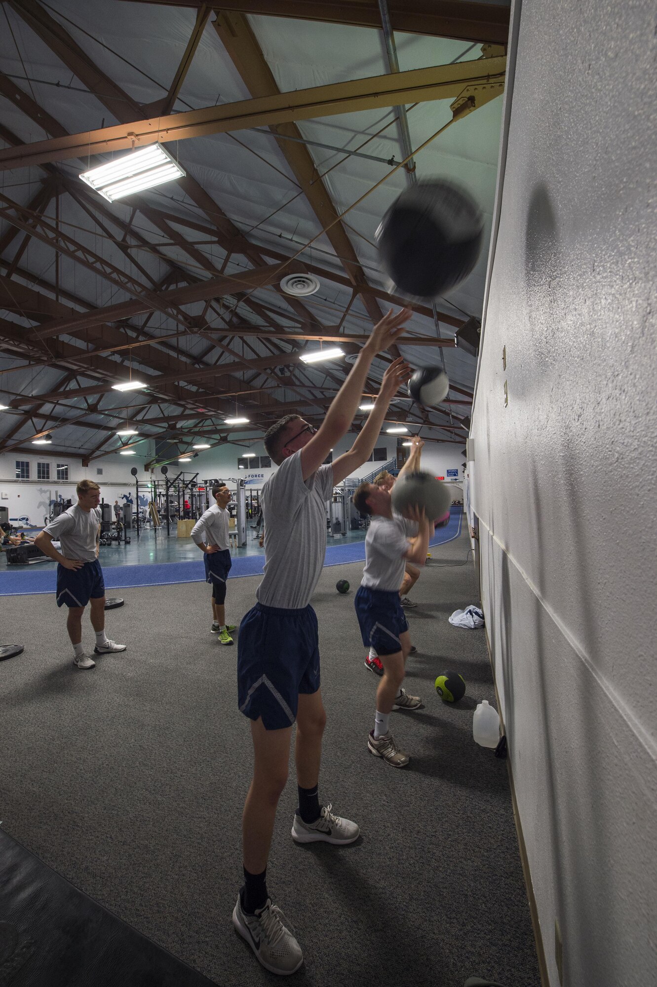 Members of the 790th Missile Security Forces Squadron perform a wall ball exercise during squadron physical training on F.E. Warren Air Force Base, Wyo., Feb. 1, 2017. Squadron commanders have the option per the 90th Missile Wing commander’s PT policy to implement group PT in their units. (U.S. Air Force photo by Staff Sgt. Christopher Ruano)
