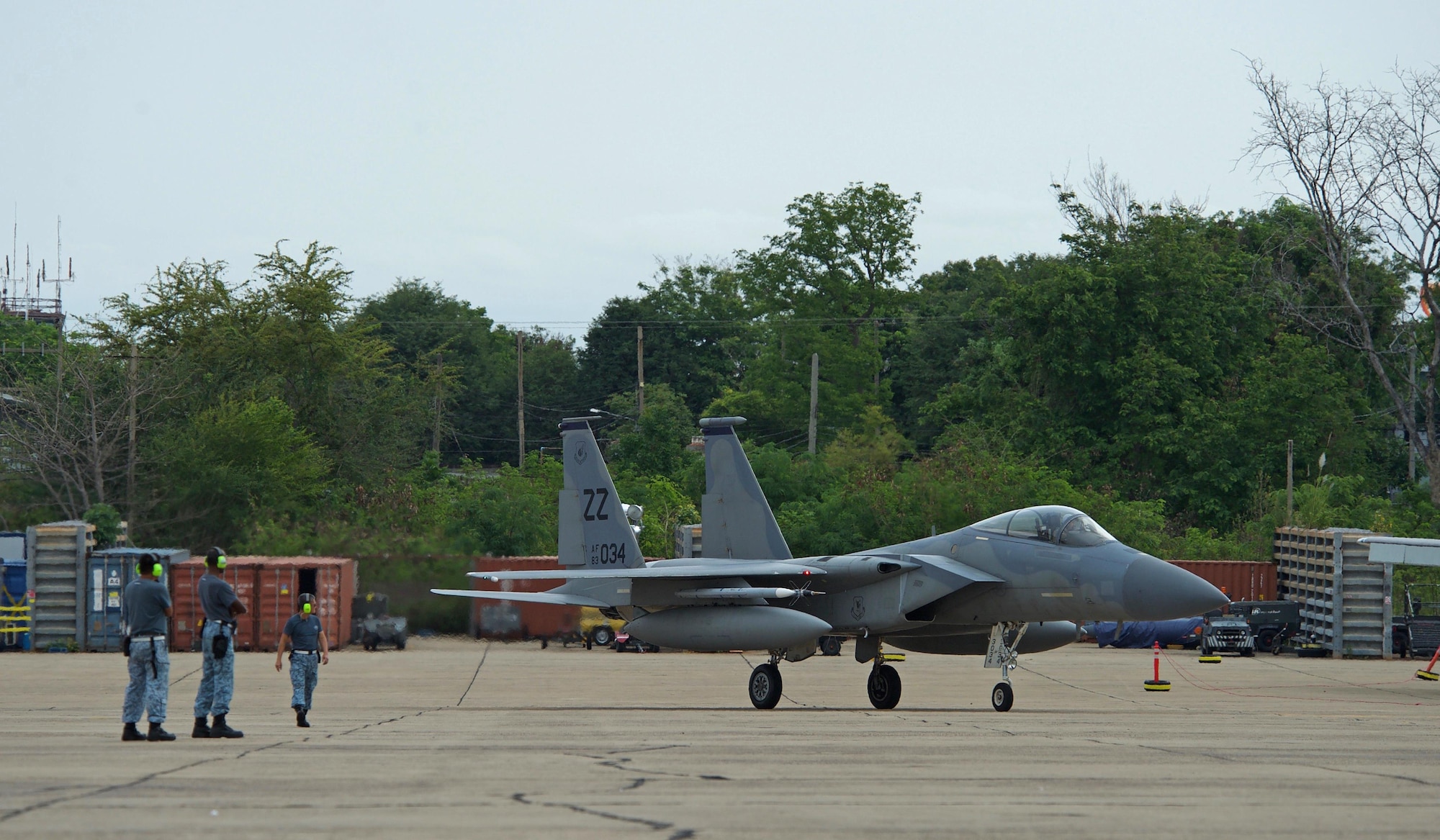 A U.S. Air Force F-15 assigned to the 44th Fighter Squadron from Kadena Air Base, Japan, taxis past Republic of Singapore air force maintainers after returning from a sortie during exercise Cope Tiger 17 at Korat Royal Thai Air Force Base, Thailand, March 27, 2017. The annual multilateral exercise, which involves a combined total of 76 aircraft and 43 air defense assets, is aimed at improving combined combat readiness and interoperability between the Republic of Singapore air force, Royal Thai air force, and U.S. Air Force, while concurrently enhancing the three nations' military relations. (U.S. Air Force photo by Staff Sgt. Kamaile Chan)