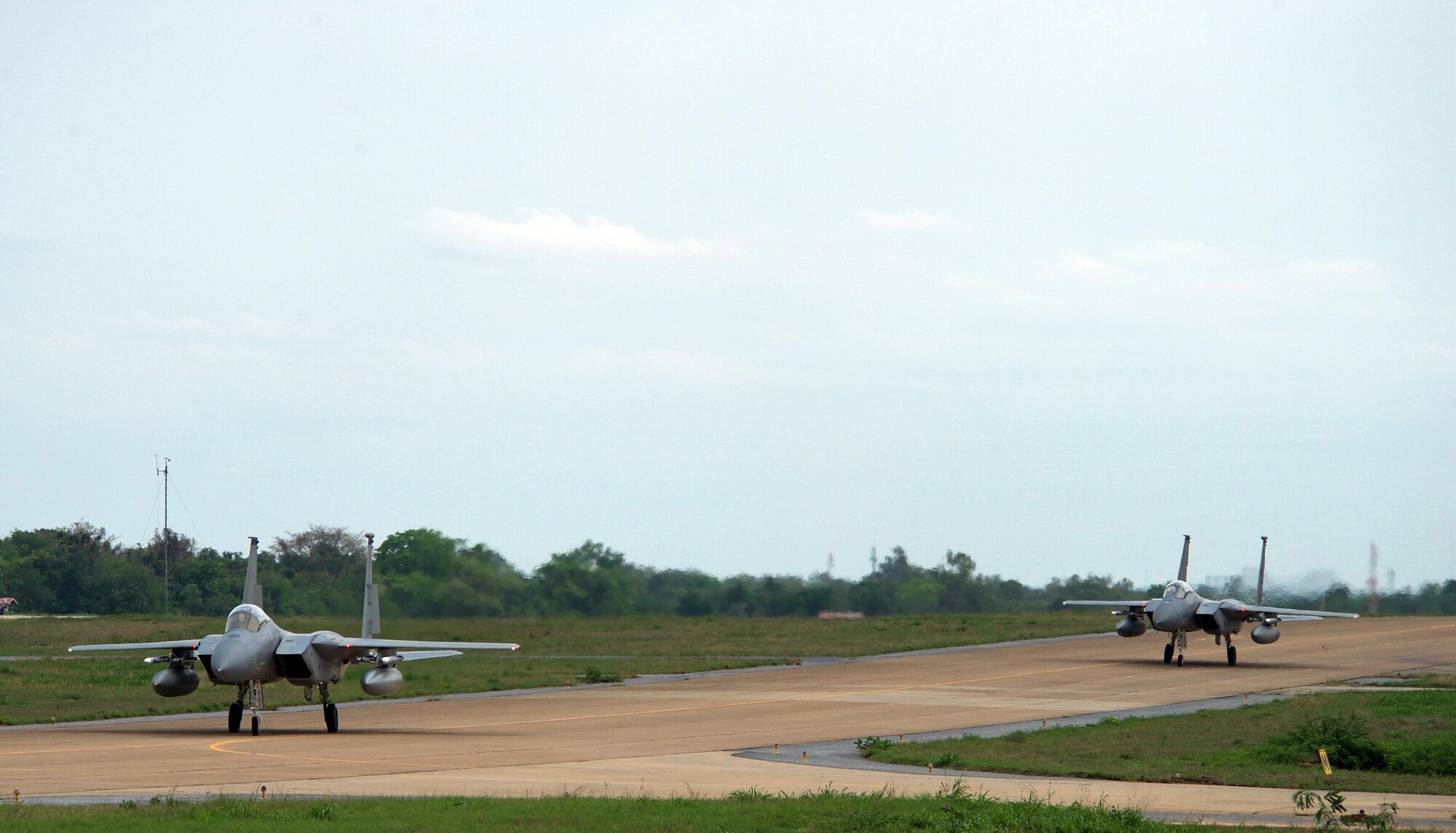 U.S. Air Force F-15s assigned to the 44th Fighter Squadron from Kadena Air Base, Japan, taxi down the runway after a training sortie during exercise Cope Tiger 17 at Korat Royal Thai Air Force Base, Thailand, March 27, 2017. The annual multilateral exercise, which involves a combined total of 76 aircraft and 43 air defense assets, is aimed at improving combined combat readiness and interoperability between the Republic of Singapore air force, Royal Thai air force, and U.S. Air Force, while concurrently enhancing the three nations' military relations. (U.S. Air Force photo by Staff Sgt. Kamaile Chan)