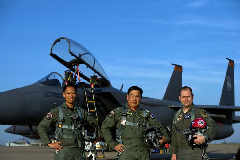 Republic of Singapore air force Col. Chan Ching Hao (left), Royal Thai air force Group Capt. Supijjarn Thamwatharsaree (center), and U.S. Air Force Lt. Col. James McFarland pose for a photo during exercise Cope Tiger 17 at Korat Royal Thai Air Force Base, Thailand, March 28, 2017. The annual multilateral exercise, which involves a combined total of 76 aircraft and 43 air defense assets, is aimed at improving combined combat readiness and interoperability between the Republic of Singapore air force, Royal Thai air force, and U.S. Air Force, while concurrently enhancing the three nations' military relations. (U.S. Air Force photo by Staff Sgt. Kamaile Chan)