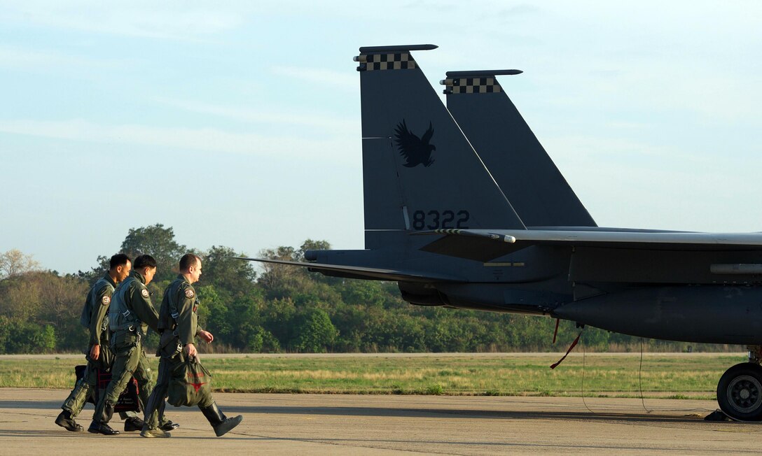 Republic of Singapore air force Col. Chan Ching Hao (left), Royal Thai air force Group Capt. Supijjarn Thamwatharsaree (center) and U.S. Air Force Lt. Col. James McFarland walk past a Republic of Singapore air force F-15 during exercise Cope Tiger 17 at Korat Royal Thai Air Force Base, Thailand, March 28, 2017. The annual multilateral exercise, which involves a combined total of 76 aircraft and 43 air defense assets, is aimed at improving combined combat readiness and interoperability between the Republic of Singapore air force, Royal Thai air force, and U.S. Air Force, while concurrently enhancing the three nations' military relations. (U.S. Air Force photo by Staff Sgt. Kamaile Chan)
