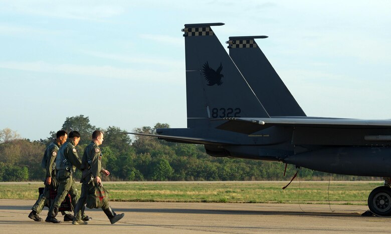 Republic of Singapore air force Col. Chan Ching Hao (left), Royal Thai air force Group Capt. Supijjarn Thamwatharsaree (center) and U.S. Air Force Lt. Col. James McFarland walk past a Republic of Singapore air force F-15 during exercise Cope Tiger 17 at Korat Royal Thai Air Force Base, Thailand, March 28, 2017. The annual multilateral exercise, which involves a combined total of 76 aircraft and 43 air defense assets, is aimed at improving combined combat readiness and interoperability between the Republic of Singapore air force, Royal Thai air force, and U.S. Air Force, while concurrently enhancing the three nations' military relations. (U.S. Air Force photo by Staff Sgt. Kamaile Chan)