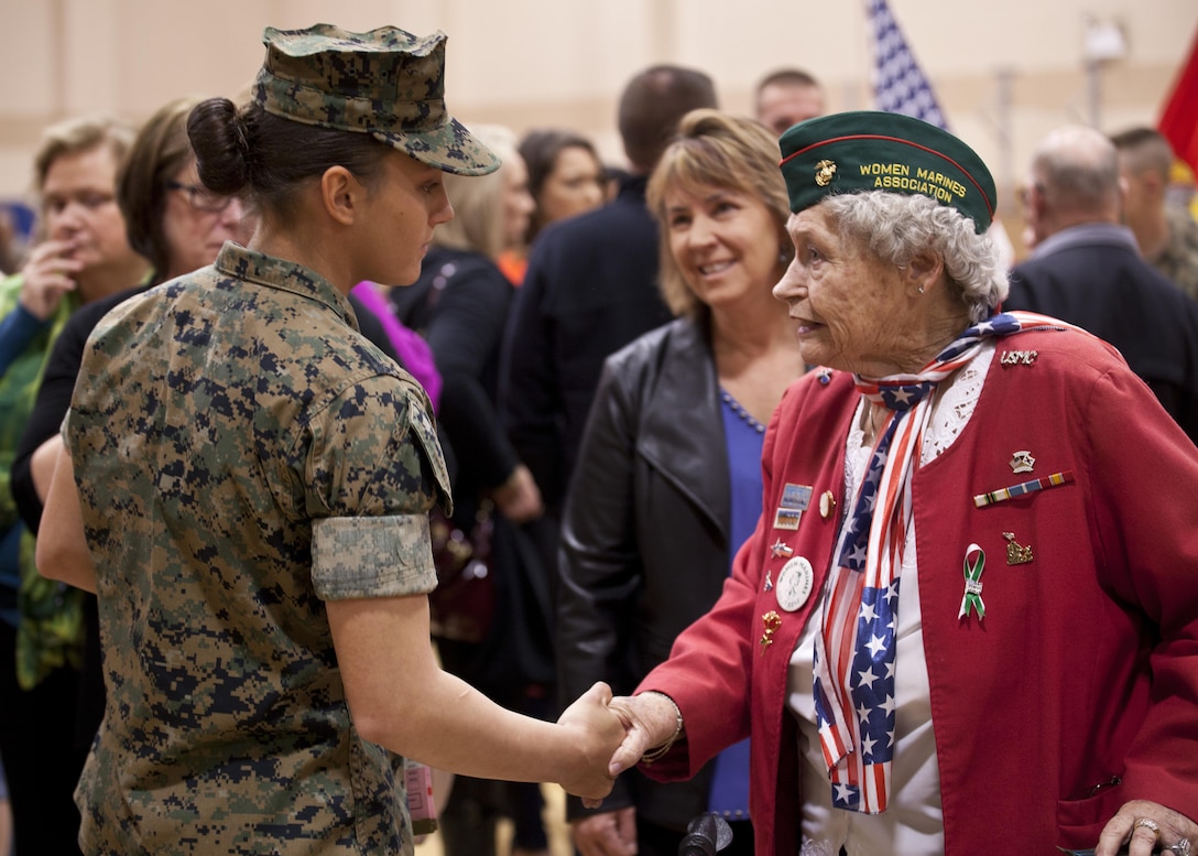 U.S. Marine Corps Pfc. Maria Daume, left, a mortarman assigned to Bravo Company, Infantry Training Battalion, School of Infantry-East, is congratulated after graduating from the Basic Mortarman course at Marine Corps Base Camp Geiger, N.C., March 23, 2017. The purpose of the Mortarman is to provide fire in support of maneuver elements using light, medium, and heavy mortars.