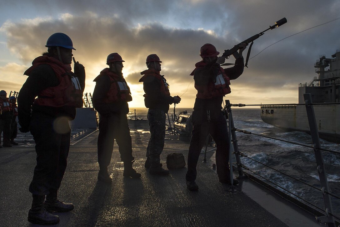 Navy Petty Officer 2nd Class James Maddox fires a shot line to the Military Sealift Command fleet oiler USNS Carl Brashear as the USS Pinckney begins a replenishment in the Pacific Ocean, March 26, 2017. The ship is participating in a composite training unit exercise, testing the mission readiness of the strike group’s assets through simulated real-world scenarios. Navy photo by Petty Officer 3rd Class Craig Z. Rodarte