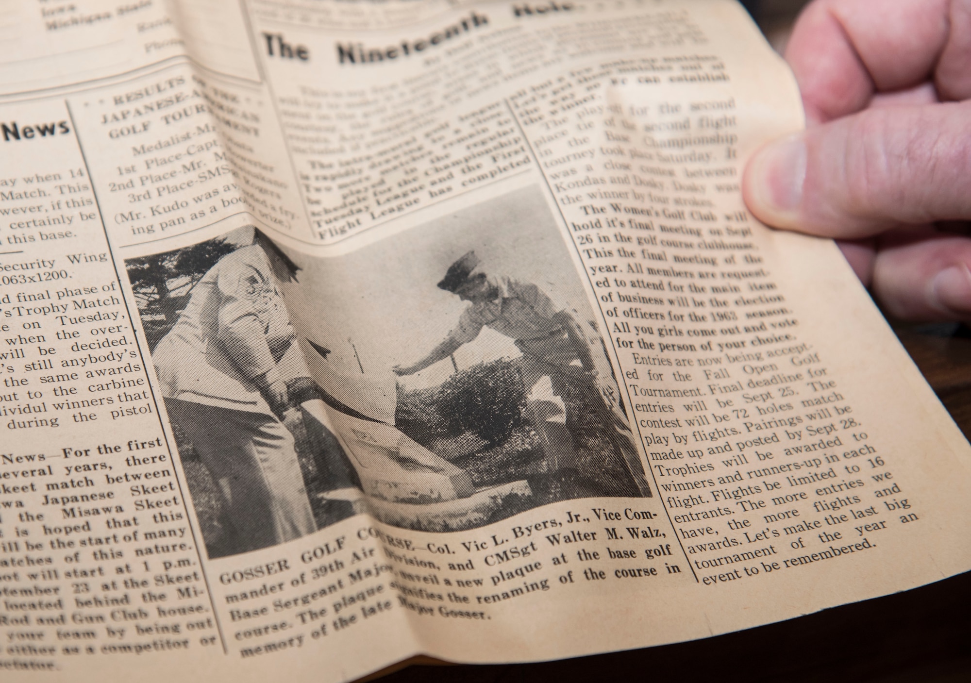 A magazine displays the day when a plaque was made at the Gosser Golf Course to honor Ret. Maj. Delbert Gosser, a 531st Tactical Fighter Squadron pilot, at Misawa Air Base, Japan, March 27, 2017. Gosser passed of injuries after ejecting and crashing an F-100 near Misawa in the Pacific Ocean. (U.S. Air Force photo by Airman 1st Class Sadie Colbert)