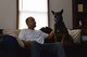 U.S. Air Force Staff Sgt. Anthony Despins, 20th Security Forces Squadron military working dog (MWD) handler, pets his dog, Jony, at his home in Sumter, S.C., March 22, 2017. Despins adopted Jony, his first MWD, after the dog retired due to a compressed disc in his spine. (U.S. Air Force photo by Airman 1st Class Destinee Sweeney)