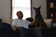 Staff Sgt. Anthony Despins, a 20th Security Forces military working dog handler, pets his dog, Jony, at his home in Sumter, S.C., March 22, 2017. Despins adopted Jony, his first MWD, after the dog retired due to a compressed disc in his spine. (U.S. Air Force photo/Airman 1st Class Destinee Sweeney)