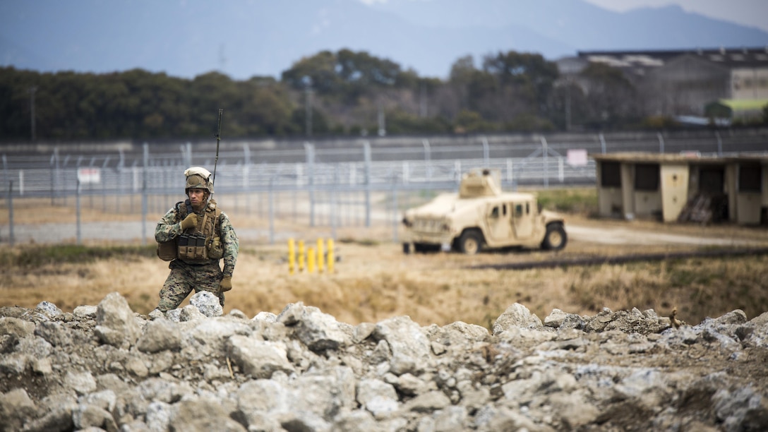 U.S. Marine Corps Gunnery Sgt. Ysac Perez, the air base ground defense staff non-commissioned officer in charge for Marine Wing Support Squadron 171, observes how Marines deal with the set objectives during exercise Tanuki Wrath on Marine Corps Air Station Iwakuni, Japan, March 22, 2017. MWSS-171 conducted the exercise to help train Marines to set up security around a downed aircraft and how to control a riot.