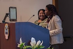 Tiffany Mpofu (left) and Olivia Walter during their Mar. 22 presentation “Working with visually impaired persons at work” at Defense Supply Center Columbus. Both women are members of the Maritime Supplier Operations contract closeout team at Defense Logistics Agency Land and Maritime. Each has learned to adapt to the challenges of Myopic Macular Degeneration.