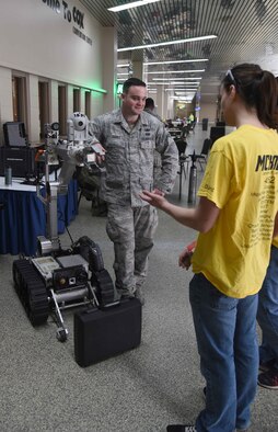 Senior Airman Ryan Garvey, 22nd Civil Engineer Squadron Explosive Ordinance Disposal journeyman, talks to For Inspiration and Recognition of Science and Technology Robotics competitors about one of EOD’s robots March 24, 2017, in Oklahoma City, Okla. The EOD Airmen showcased their unique part of McConnell’s mission set to teens interested in science, technology, electronics and mathematics careers. (U.S. Air Force photo/Airman 1st Class Erin McClellan)