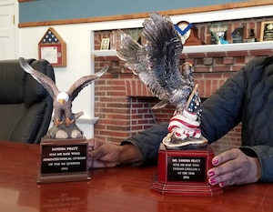 Sandra Pratt, 633rd Air Base Wing Chapel information and referral assistant, displays the trophies that she received for winning the 633rd ABW Admin and Technical Civilian of the Quarter award for the fourth quarter 2016, and Civilian Category I of the Year award for 2016, at Joint Base Langley-Eustis, Va., March 17, 2017. Pratt also won the annual Air Force Chaplain Corps’ Outstanding Civilian of the Year award for 2016. At the end of March, the OCY award will be presented during the Chaplain Corps’ summit in San Antonio, Texas. (U.S. Air Force photo/Beverly Joyner)