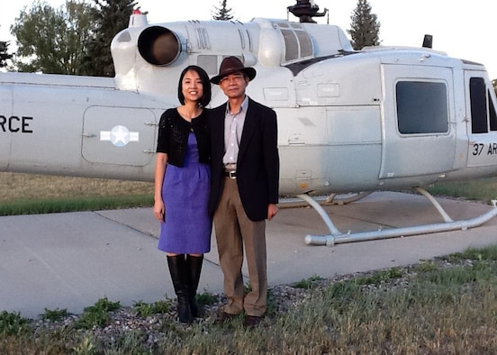 Capt. (Dr.) Thanh Thao Le, 66th Medical Squadron physician, poses with her father, Minh Le, following her commissioning ceremony at F.E. Warren Air Force Base, Wyoming, in July 2011. Le, who will pin on major in July, treats a wide-spectrum of patients at the Hanscom clinic. (Courtesy photo)