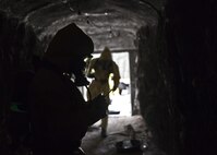 U.S. service members attending Naval School Explosive Ordnance Disposal (NAVSCOLEOD) conduct chemical biological handling of hazardous materials and decontamination during a simulated cave training exercise at Eglin Air Force Base, Fla., March 8, 2017. The purpose of NAVSCOLEOD is to train technicians in basic, as well as advanced, courses to perform various duties that include locating, identifying, rendering safe, and disposing of bombs and other hazardous materials. (U.S. Marine Corps photo by Cpl. Laura Mercado)