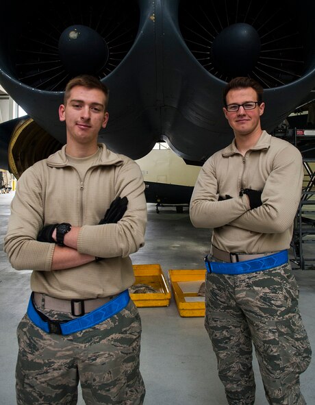 (From left) Airman 1st Class Zachary Campfield and A1C Nicholas Beltz, 5th Maintenance Squadron crew chiefs, stand in front of two B-52H Stratofortress engines at Minot Air Force Base, N.D., March 23, 2017. The crew chiefs coordinate and perform aircraft maintenance to ensure all components are functioning properly. (U.S. Air Force photo/Airman 1st Class Jonathan McElderry)
