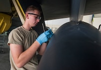 Airman 1st Class Zachary Campfield, 5th Maintenance Squadron crew chief, removes tape from a B-52H Stratofortress component at Minot Air Force Base, N.D., March 20, 2017. These maintainers guarantee Minot AFB B-52H Stratofortresses are ready to fly at a moment’s notice. (U.S. Air Force photo/Airman 1st Class Jonathan McElderry)