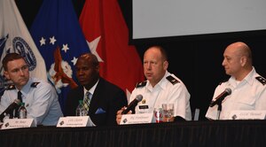 U.S. Army Col. Ralph Clayton, 733rd Mission Support Group, commander, answers an audience member’s question during Fort Eustis’ Town Hall at Joint Base Langley-Eustis, March 24, 2017. Clayton sat with a group of other panelists from agencies across the installation to hear the community’s concerns about various issues, from the implementation of bus stop coverings, to gaining further knowledge about the base’s concealed weapon policy. (U.S. Air Force photo/Airman First Class Kaylee Dubois)