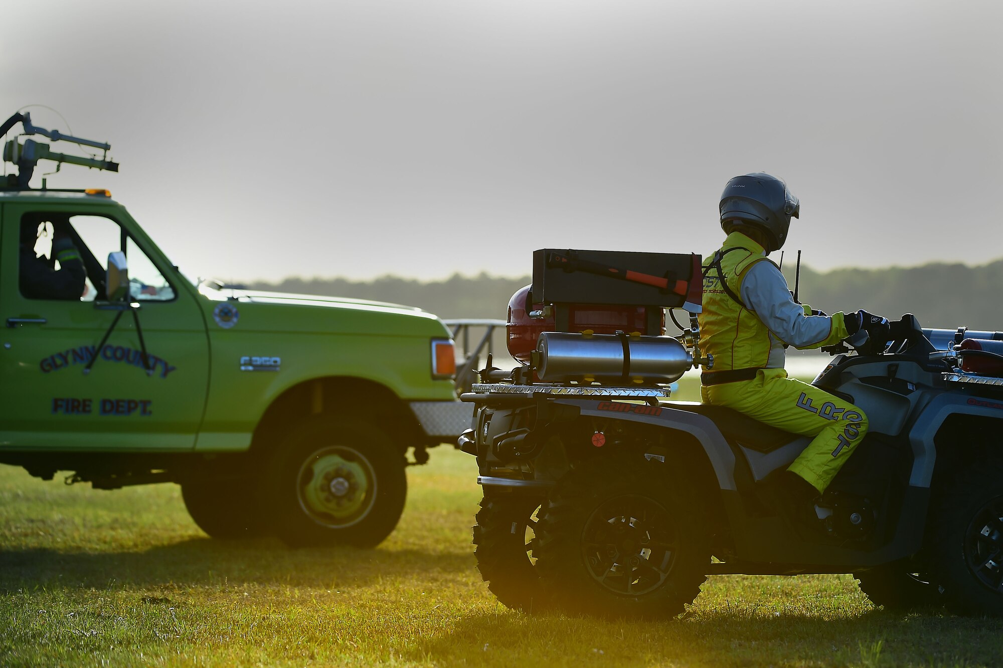 First responders observe an aerial demonstration at the Wings Over Golden Isles Air Show in Brunswick, Ga., March 24, 2017. The first responders ensured the safety of all aircraft and ground crew by providing their support during the air show. (U.S. Air Force photo/Senior Airman Kimberly Nagle)