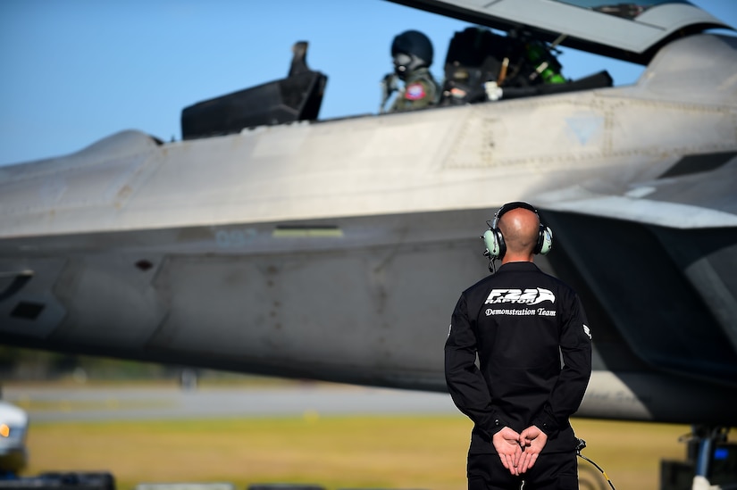 U.S. Air Force Senior Airman Nicholas Banducci, F-22 Raptor Demonstration Team crew chief, prepares to launch the jet during the conclusion of the Wings Over Golden Isles Air Show in Brunswick, Ga., March 27, 2017. Banducci assisted with more than 5 successful launch and recoveries of the F-22 throughout the duration of the air show. (U.S. Air Force photo/Senior Airman Kimberly Nagle)