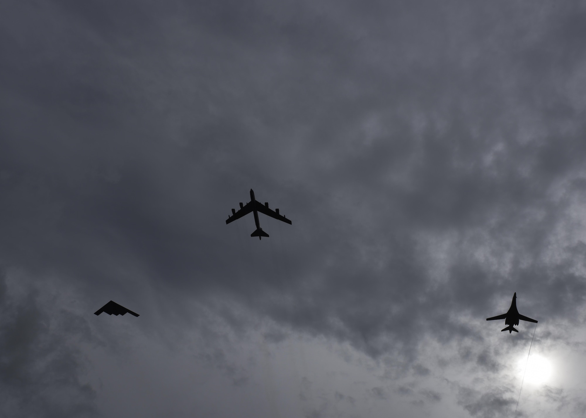 A B-52 Stratofortress, B-1 Lancer and B-2 Spirit conduct a flyover at Andersen Air Force Base, Guam, Aug.17, 2016. This marks the first time in history that all three of Air Force Global Strike Command's strategic bomber aircraft are simultaneously conducting operations in the U.S. Pacific Command area of operations. The B-1 Lancer, which arrived at Andersen Aug. 6, will replace the B-52 in support of the U.S. Pacific Command Continuous Bomber Presence mission. The CBP bomber swap between the B-1 and B-52 is occurring throughout the month of August as the B-1s return to support this mission for the first time since April 2006. (U.S. Air Force photo by Tech Sgt Richard P. Ebensberger/Released)