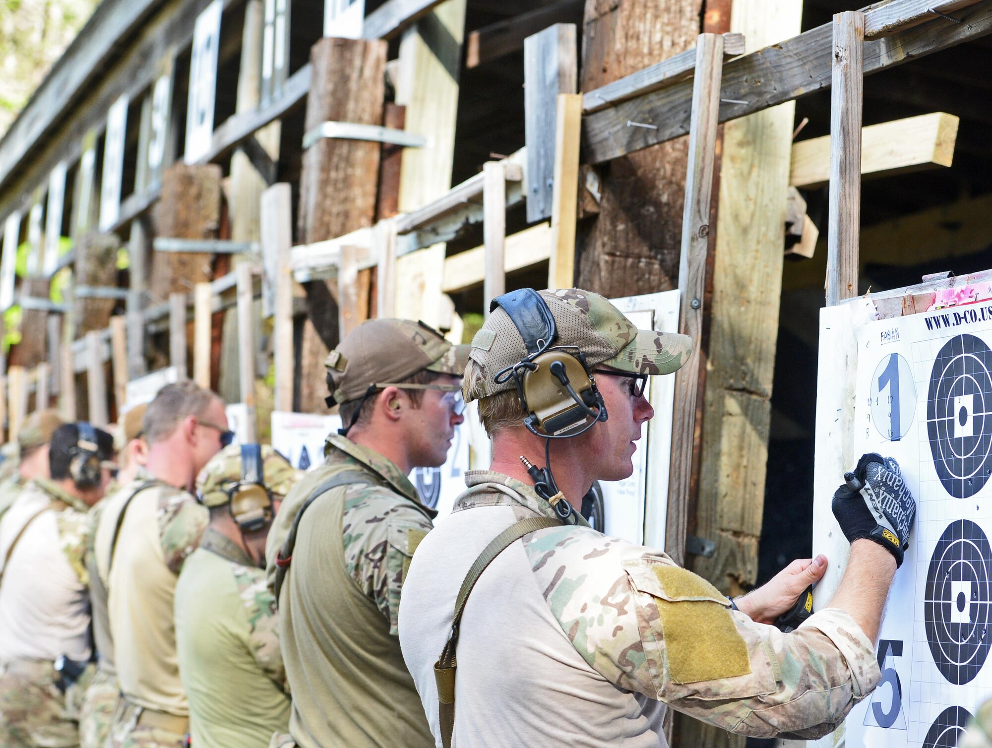Combat controllers grade their targets at the Fire and Pistol Club on Hurlburt Field, Fla., March 29, 2017. They are highly trained special operations forces that integrate air power into the special operations battlespace. (U.S. Air Force photo/Staff Sgt. Melanie Holochwost)