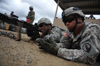 U.S. Army Reserve Soldiers, Spc. Xavier Reyes and Spc. Uriel Torres, assigned to the 941st Quartermaster Company, fire the M240B during a crew serve weapons range on Camp Santiago, Puerto Rico, March 25. The purpose of the range was for Soldiers to familiarize themselves and qualify with their assigned crew serve weapons. A total of 78 Soldiers from the 1st Mission Support Command qualified with their assigned weapons and have increased their unit readiness levels.