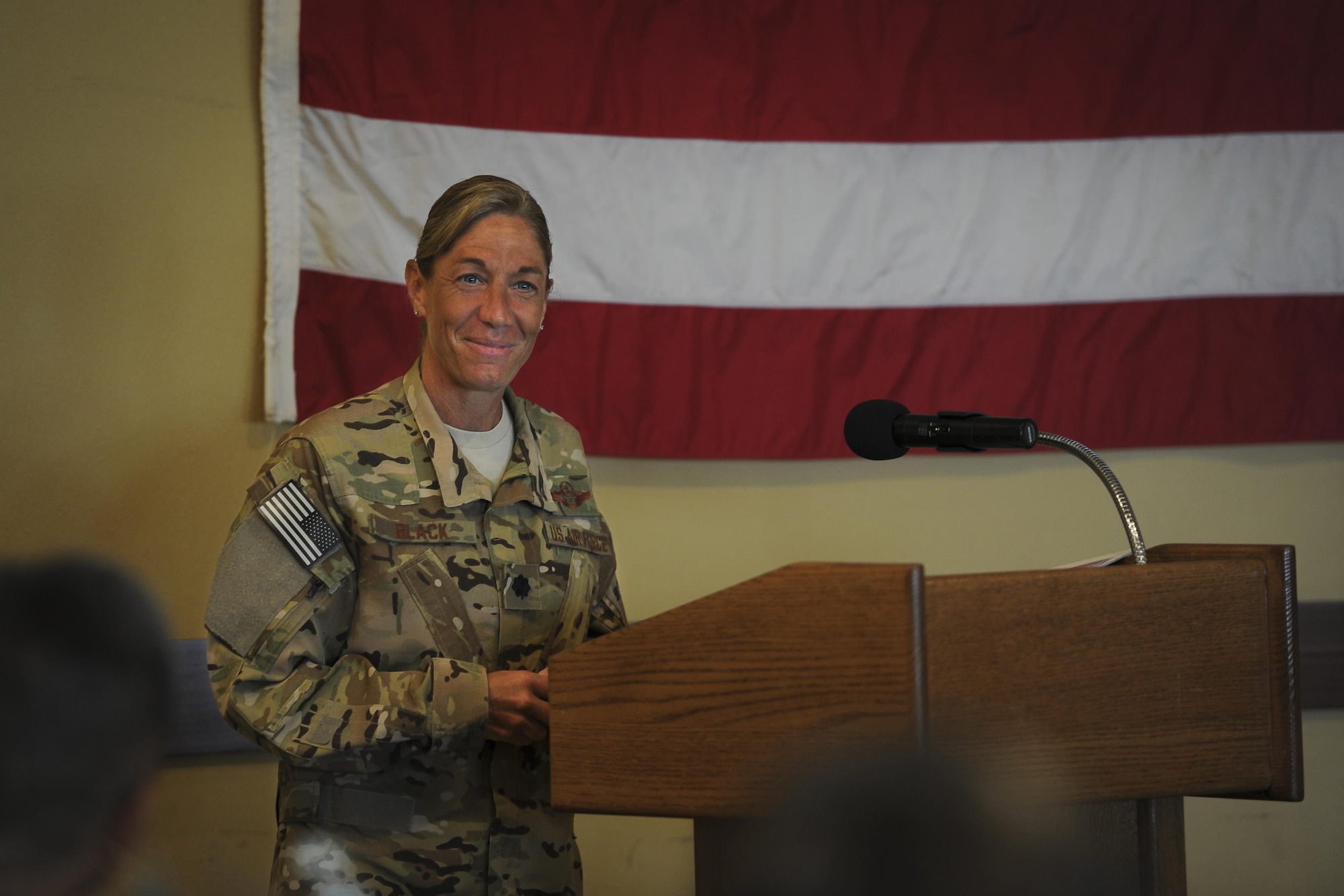 Lt. Col. Allison Black, the commander of the 319th Special Operations Squadron, speaks during the Women's History Month luncheon at Hurlburt Field, Fla., March 23. During the event, Black told the audience of the struggles and successes she's experienced as a woman in the military and encouraged all genders to grow confident in who they are. (U.S. Air Force photo by Airman 1st Class Dennis Spain)